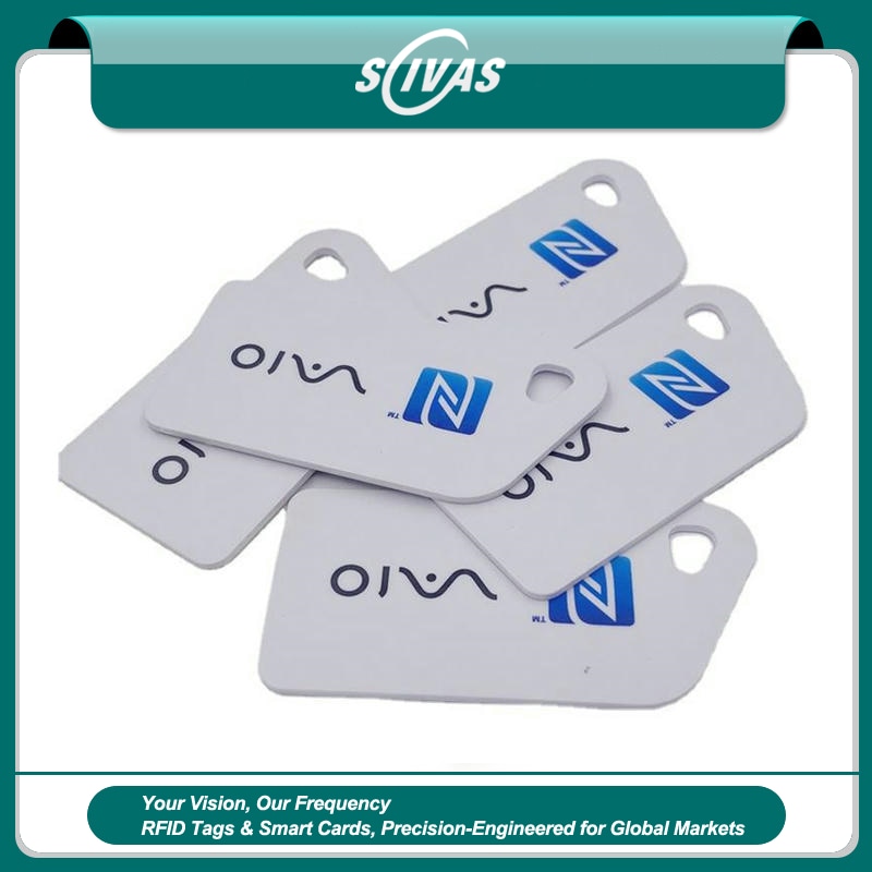 1) ภาพนี้แสดงมินิการ์ด NFC พิมพ์โลโก้สำหรับรีวิวและสะสมคะแนน โดยเน้นขนาดกะทัดรัด การทำงานรวดเร็ว พื้นที่สำหรับโลโก้และแบรนด์สั่งทำ และการใช้งานร่วมกับสมาร์ตโฟนและแอปมือถือ สำหรับการจัดการอุปกรณ์อิเล็กทรอนิกส์และทรัพย์สิน IT.